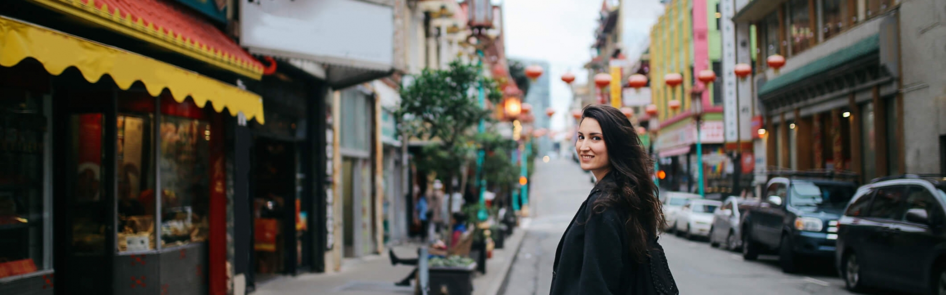 woman walking around chinatown in san francisco