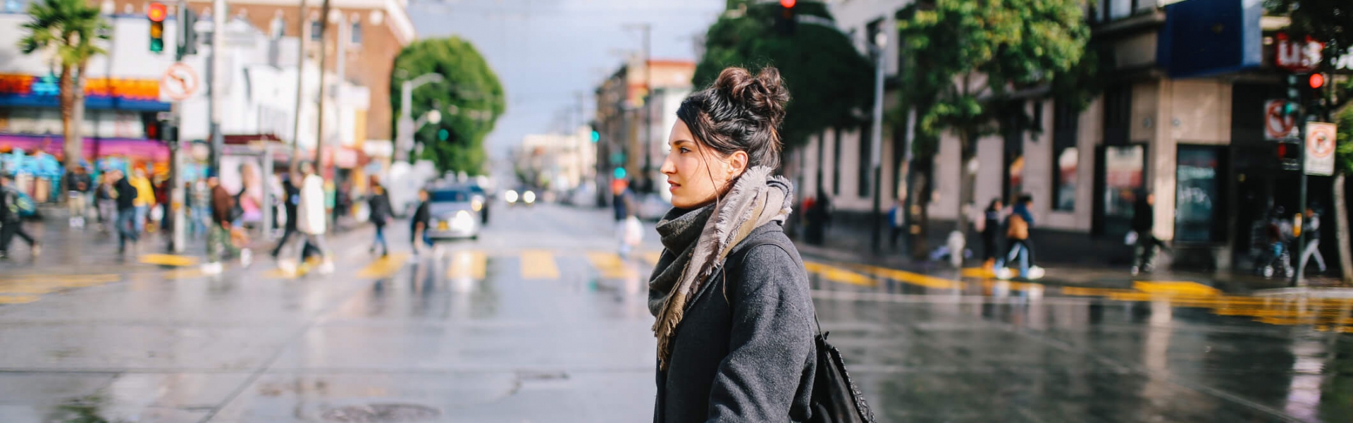 woman walks across the street in san francisco neighborhood