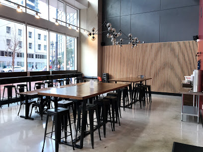 restaurant interior with long tables and stools