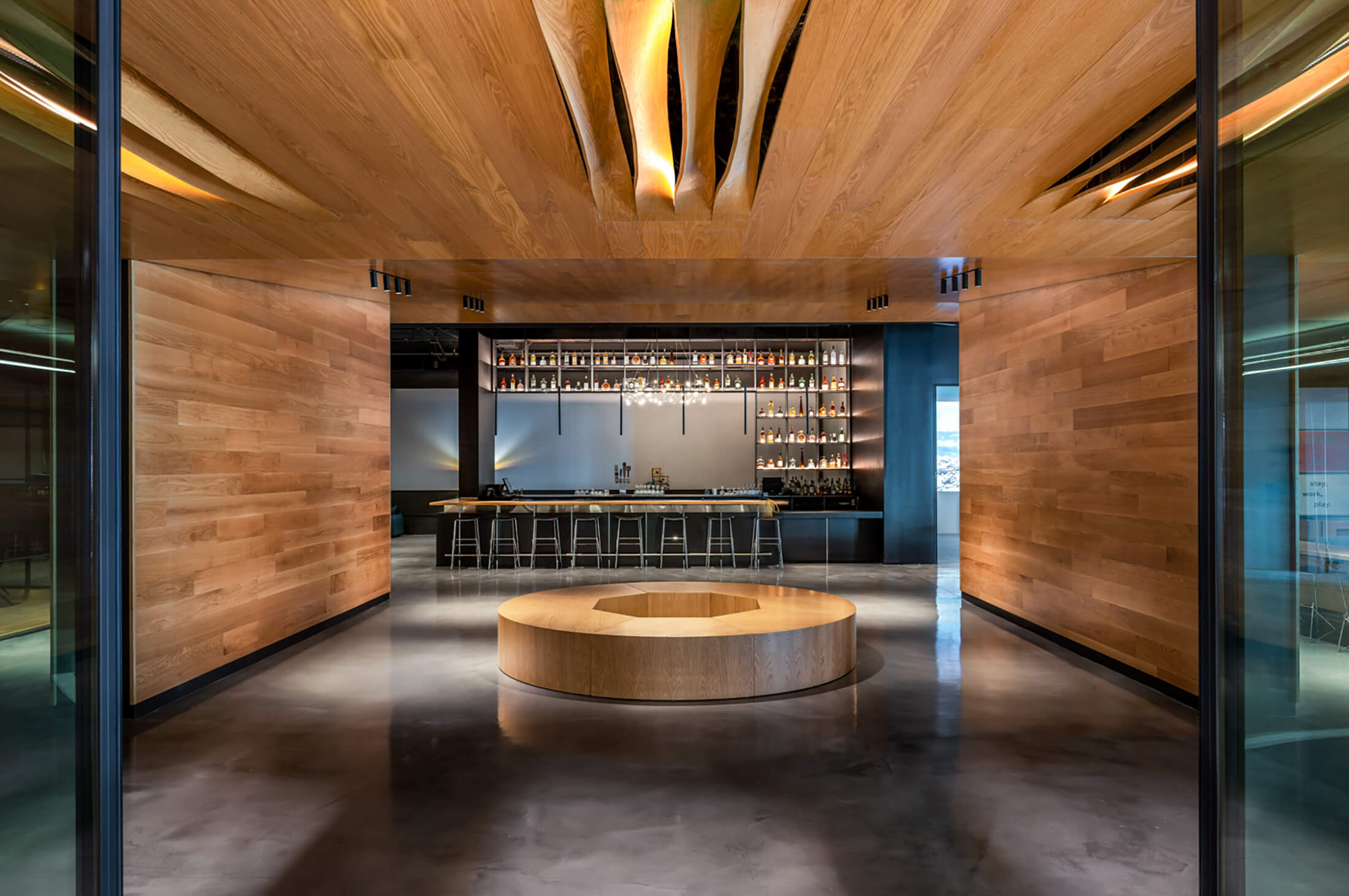 dramatic shot of the lobby area with bar at the back.