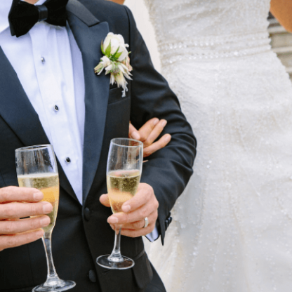 Bride and Groom holding champagne