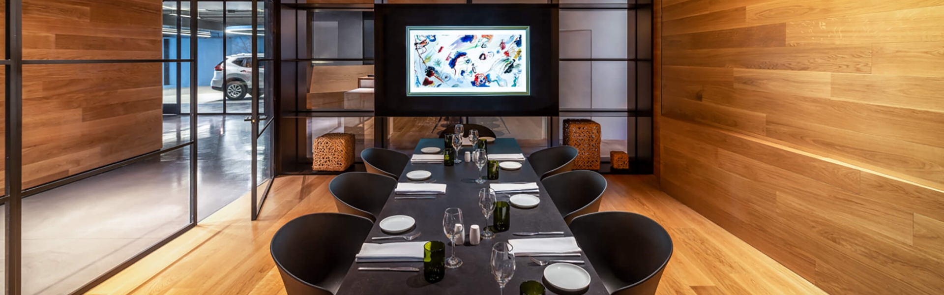 boardroom with wooden walls and ceiling, complete with stylized chandelier