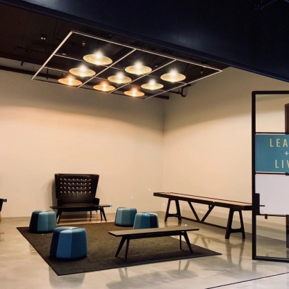 meeting space with various types of chairs and sliding glass doors
