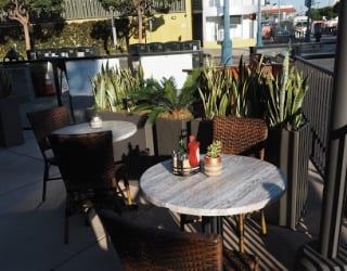 tables on patio with plants