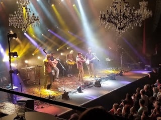 The Fillmore with a band playing on stage